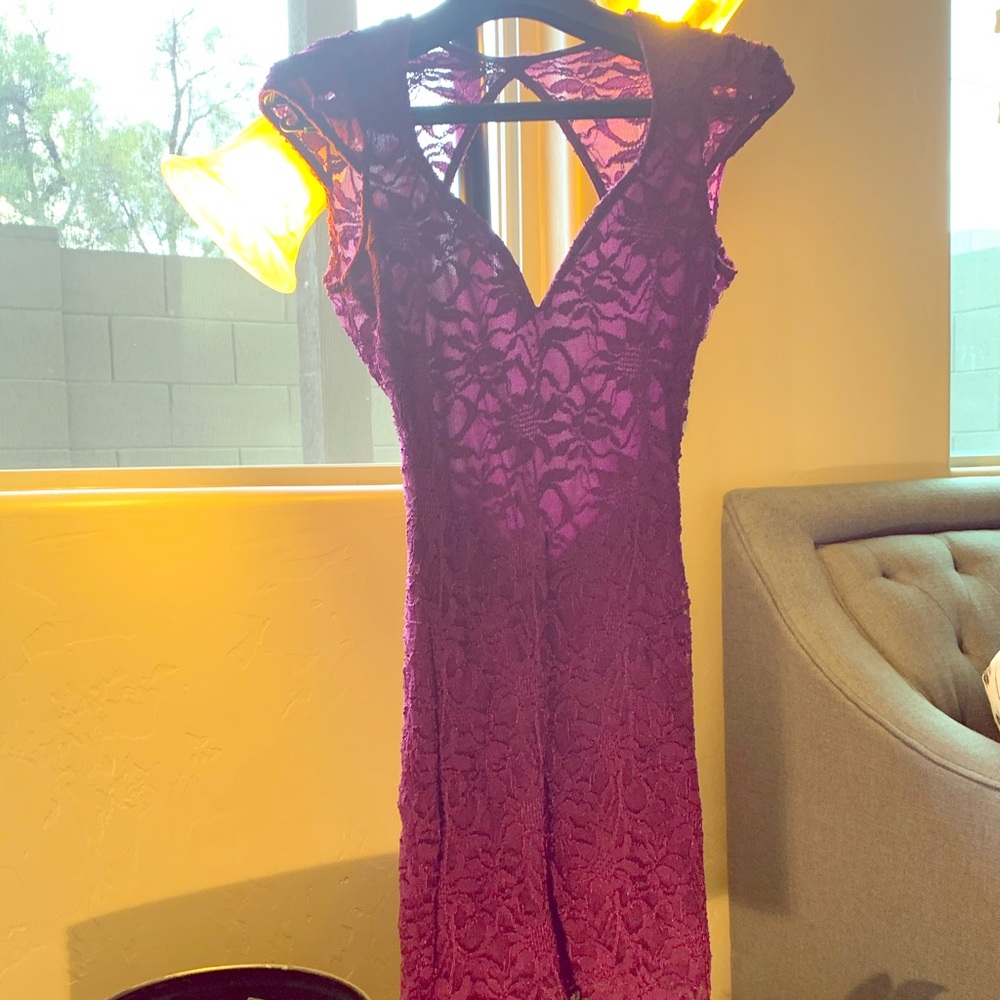 Laced, knee length dress.